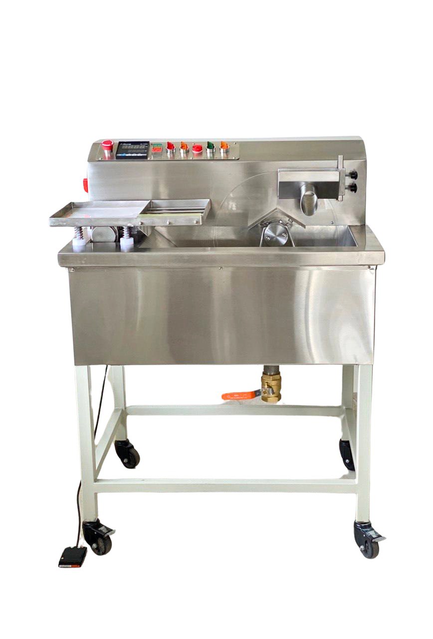 Tempering and Moulding Chocolate machine from Mangharam, ChocoMan 30 Deluxe, fully equipped with Bonfiglioli motors and Siemens switchgear, featuring a vibrating table, Day and Night Heat Mode, and a Lower arm for efficient production.