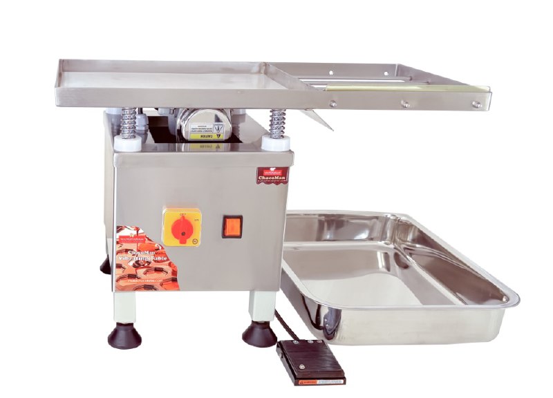 Stainless steel vibrating table on a white background, manufactured by Mangharam from Bangalore.