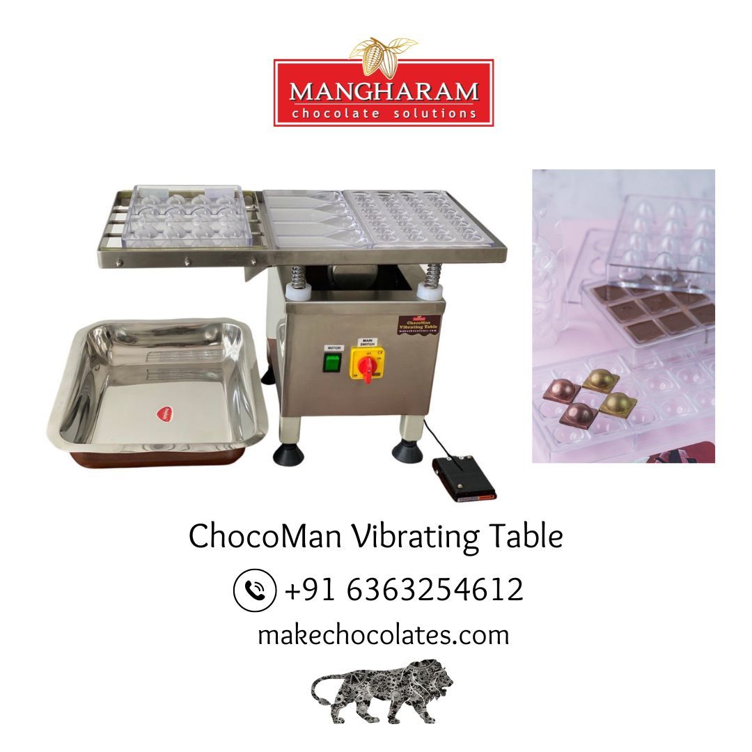 The image shows the ChocoMan Vibrating Table Machine, with the capability to remove air bubbles from chocolate moulds. It includes a stainless steel table with a vibration mechanism, a foot pedal, and a collection tray.