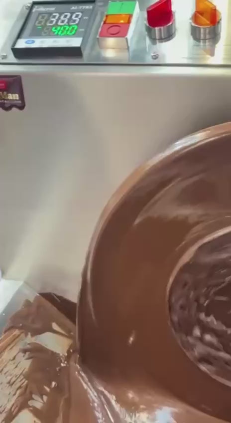 Video of ChocoMan 15 Neo showcasing the smooth turning of the wheel while lifting tempered chocolate into the spout, ready for moulding