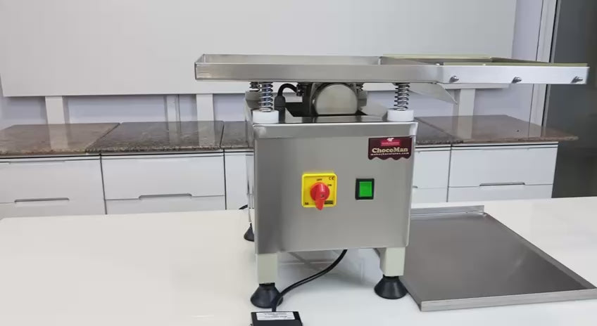 Video showing the vibrating table for chocolate moulds, manufactured by Mangharam