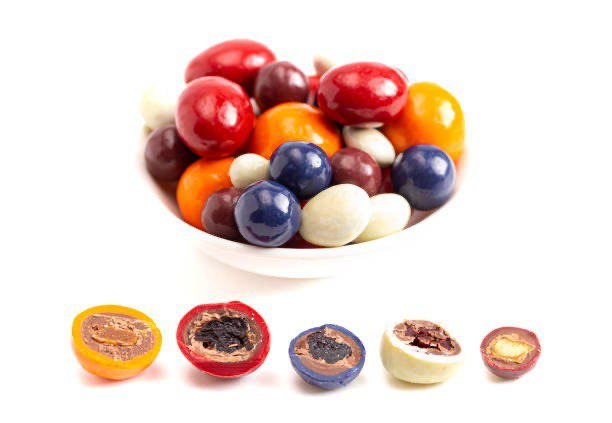 Colourful chocolate coated dried fruit, berries and hazelnut tempting display can be created using ChocoMan Spin from Mangharam