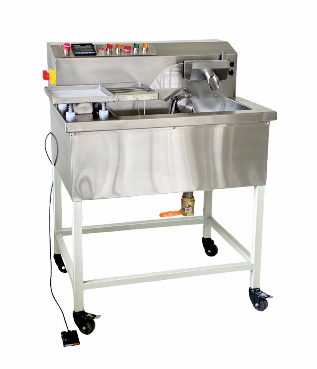 Tempering and Moulding Chocolate machine from Mangharam, ChocoMan 30 Deluxe, fully equipped with Bonfiglioli motors and Siemens switchgear, featuring a vibrating table, Day and Night Heat Mode, and a Lower arm for efficient production.